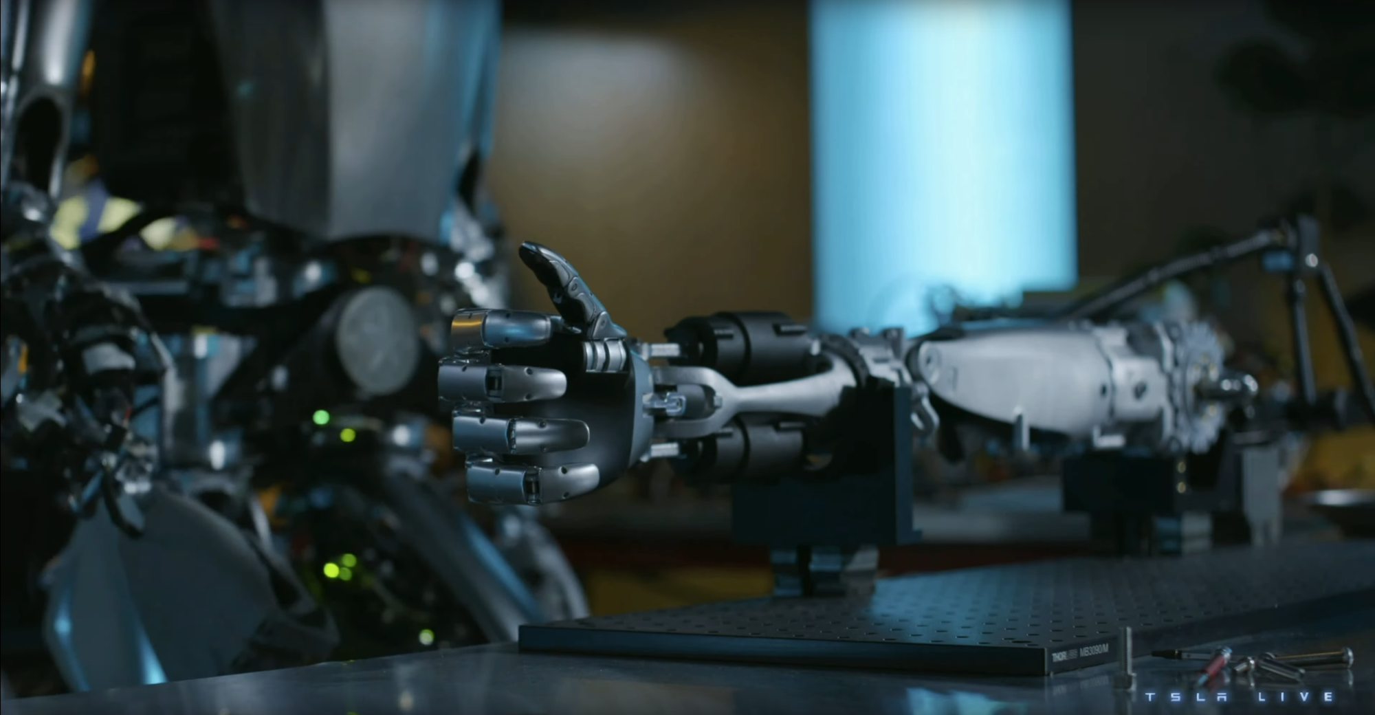 Screenshot of a humanoid robot arm from Tesla 2023 Investor Day